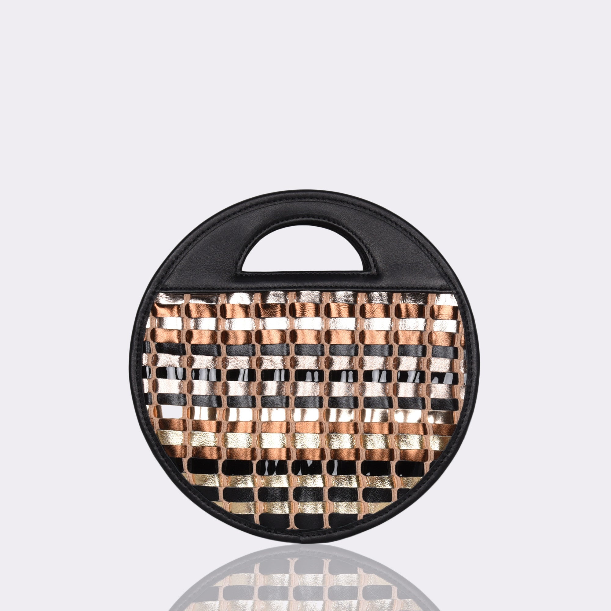Picture of American made luxury top handle round crossbody bag with various neutral toned metallic handwoven leathers.
