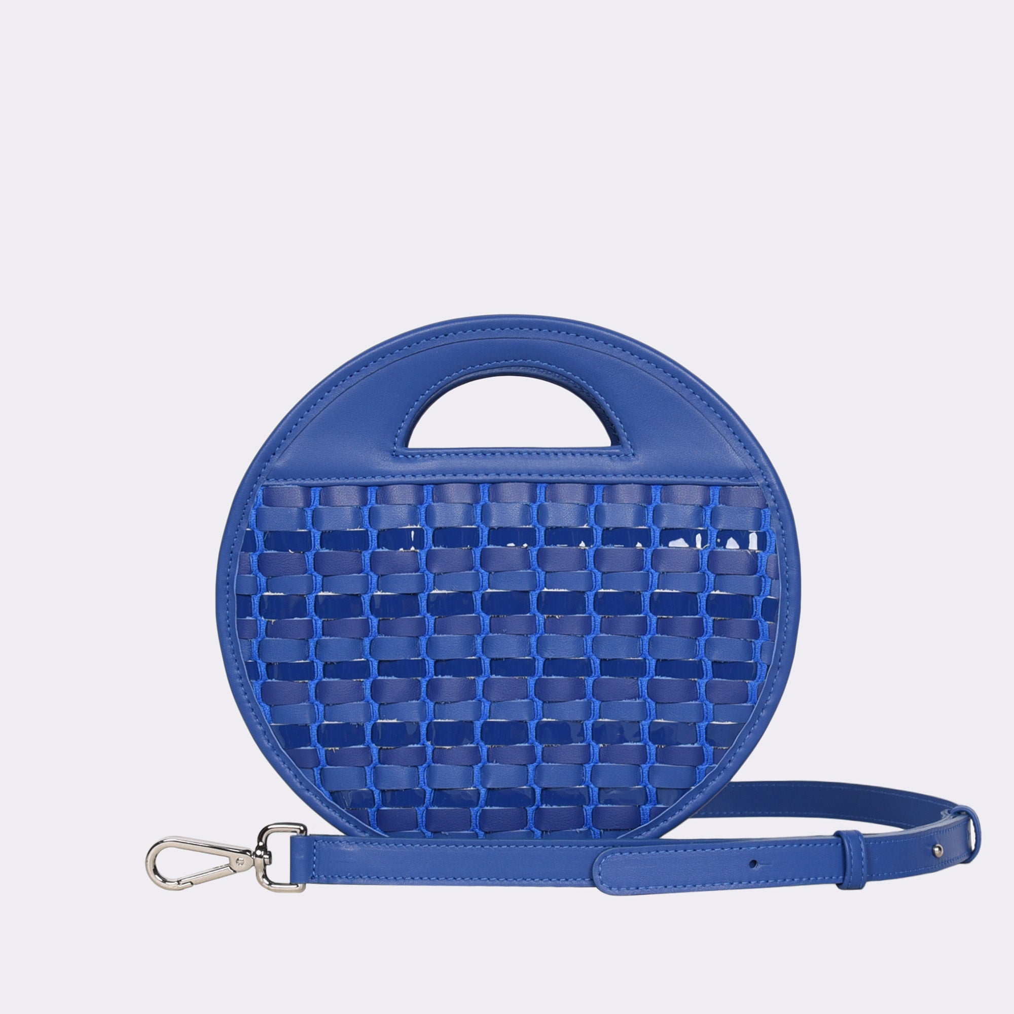 Picture of American made luxury top handle round crossbody bag with various matte and metallic blue toned handwoven leathers.